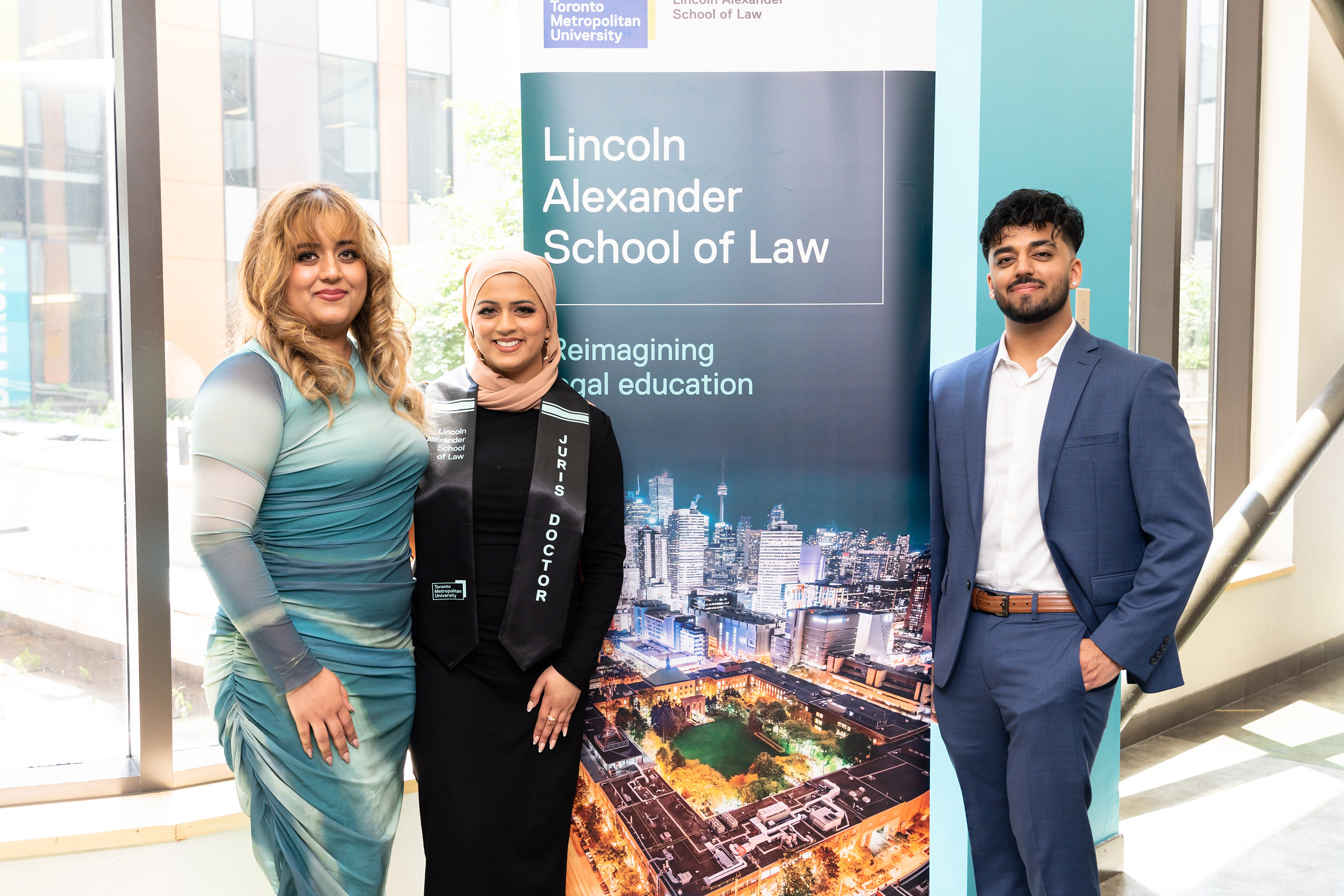 grad and family posing at celebration