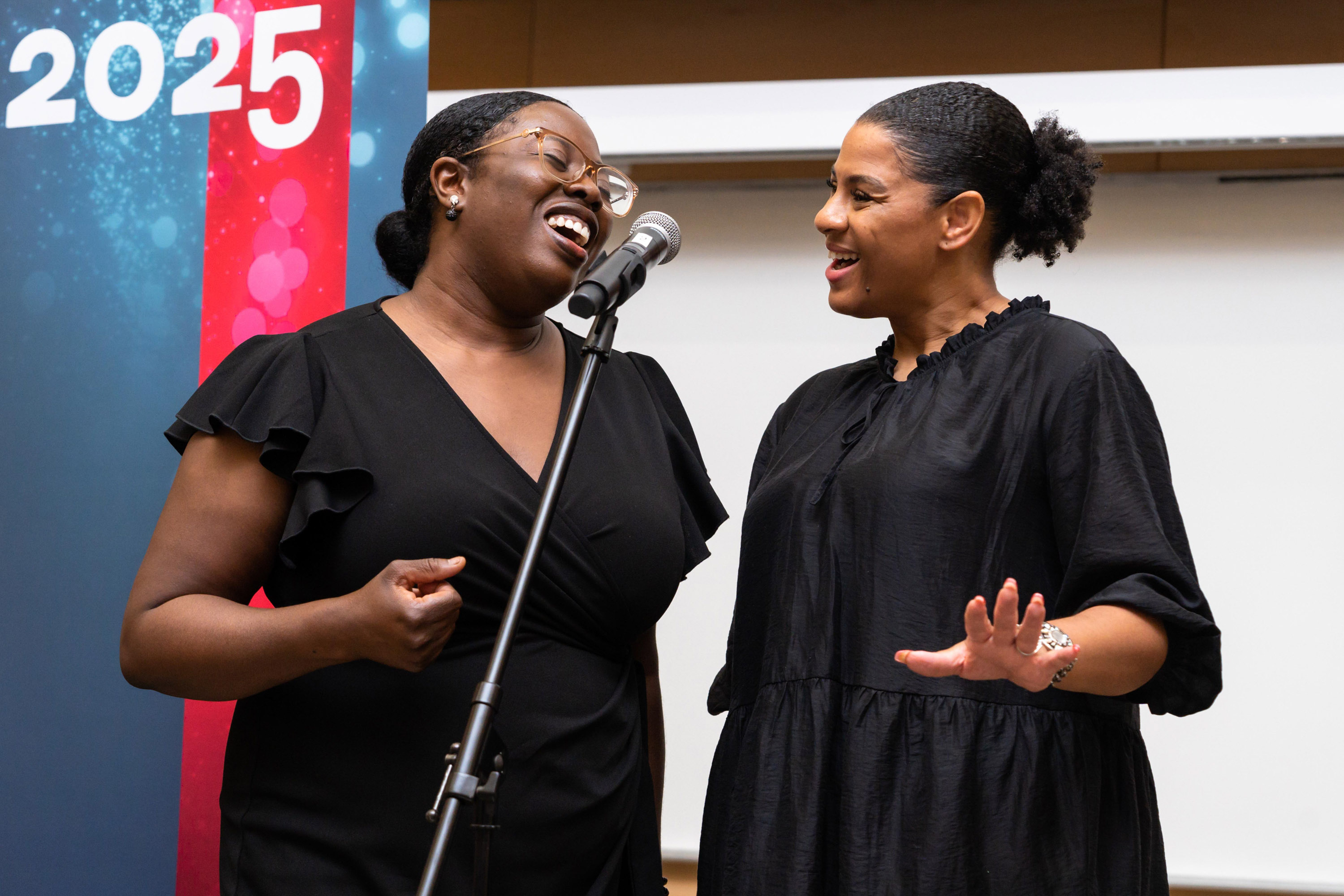 two women singing at celebration