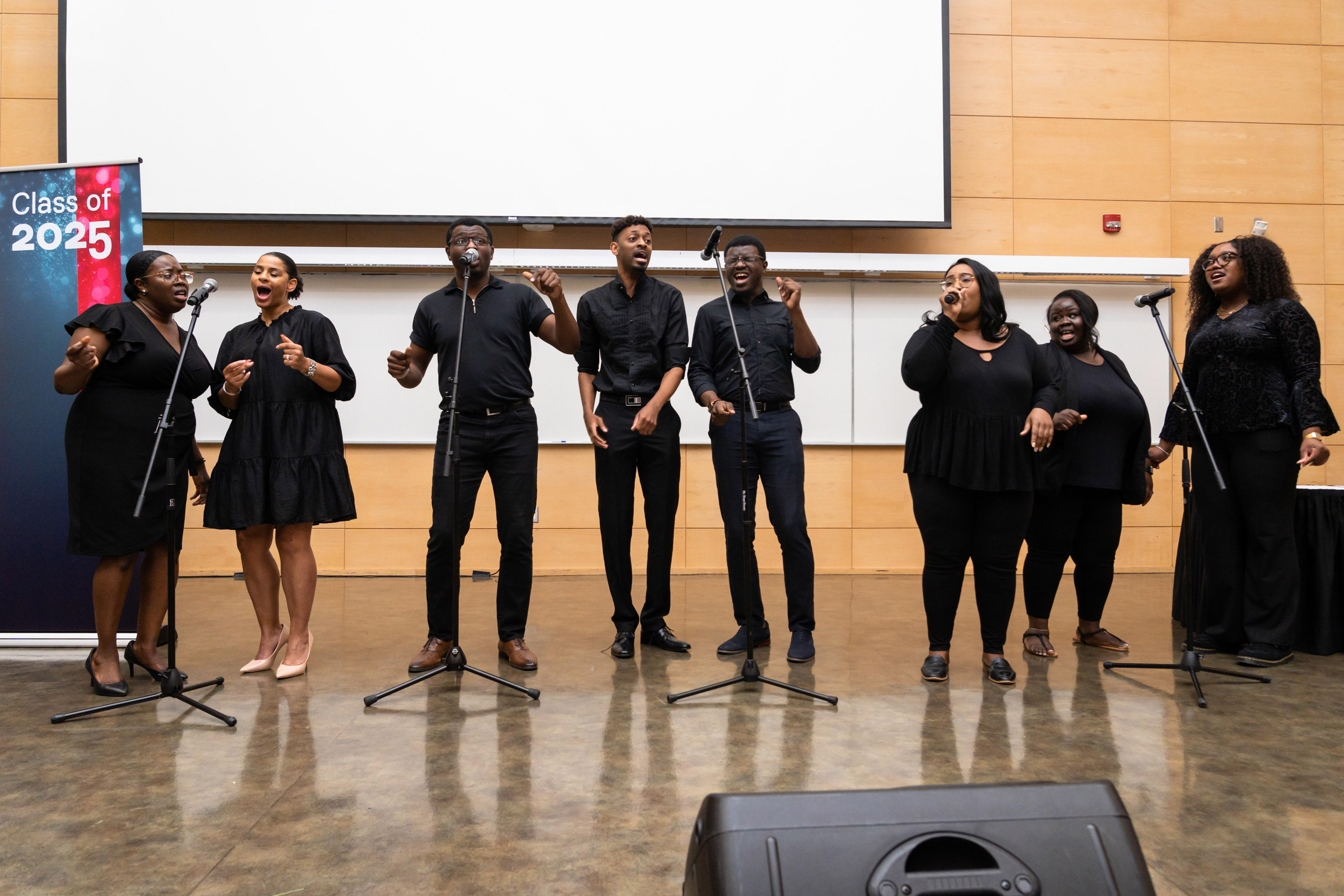 group of singers performing on stage at celebration