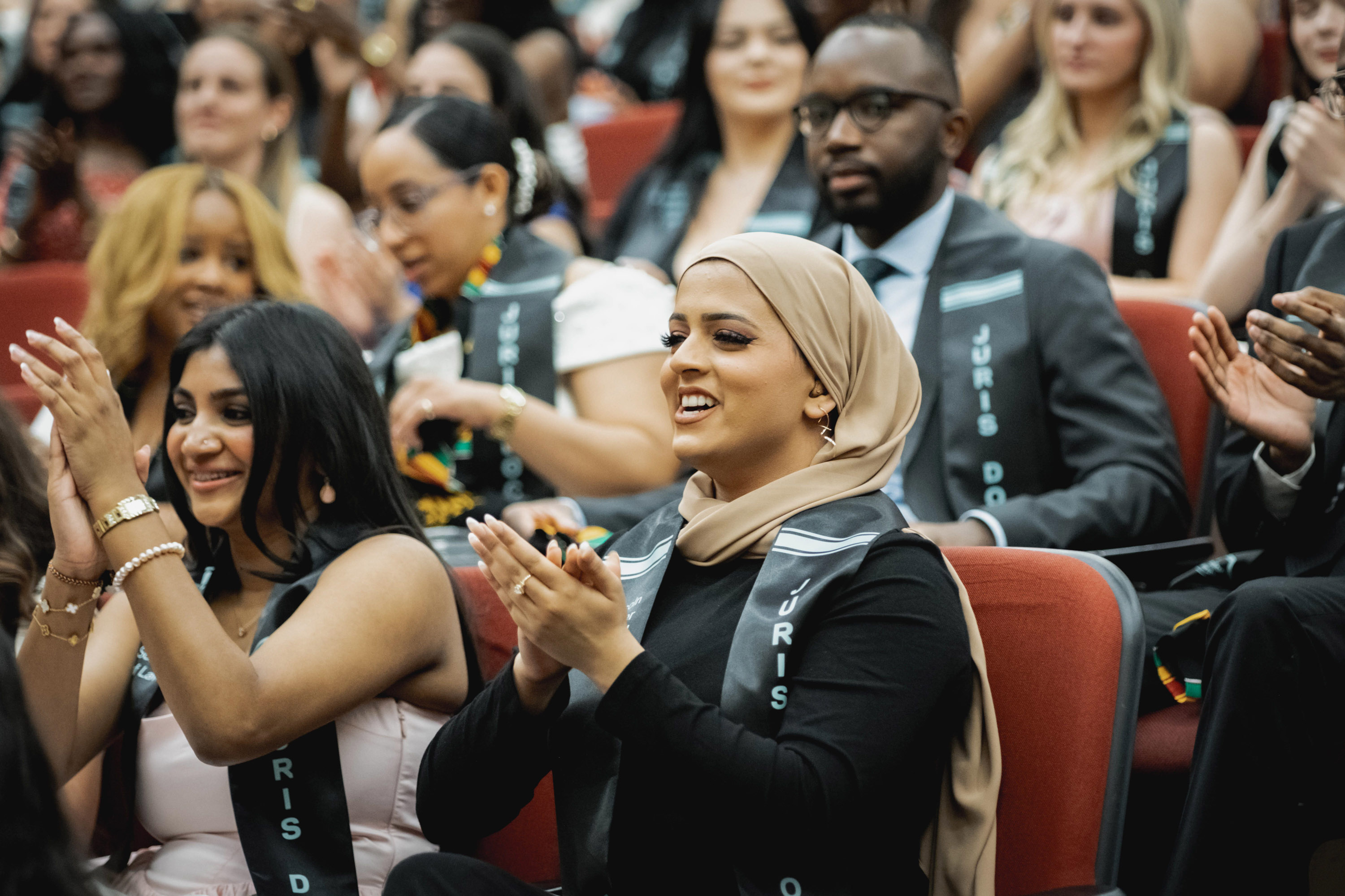 grad clapping in audience 