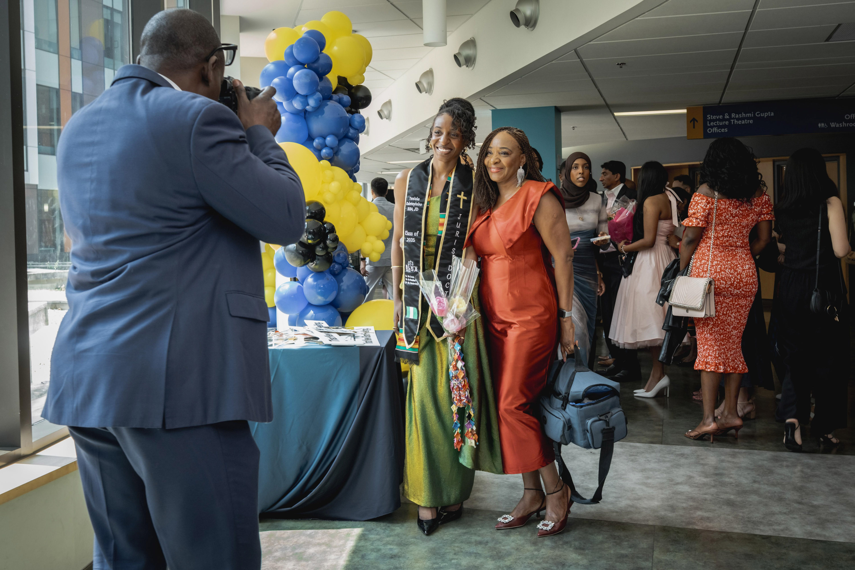 grad and family getting photo taken