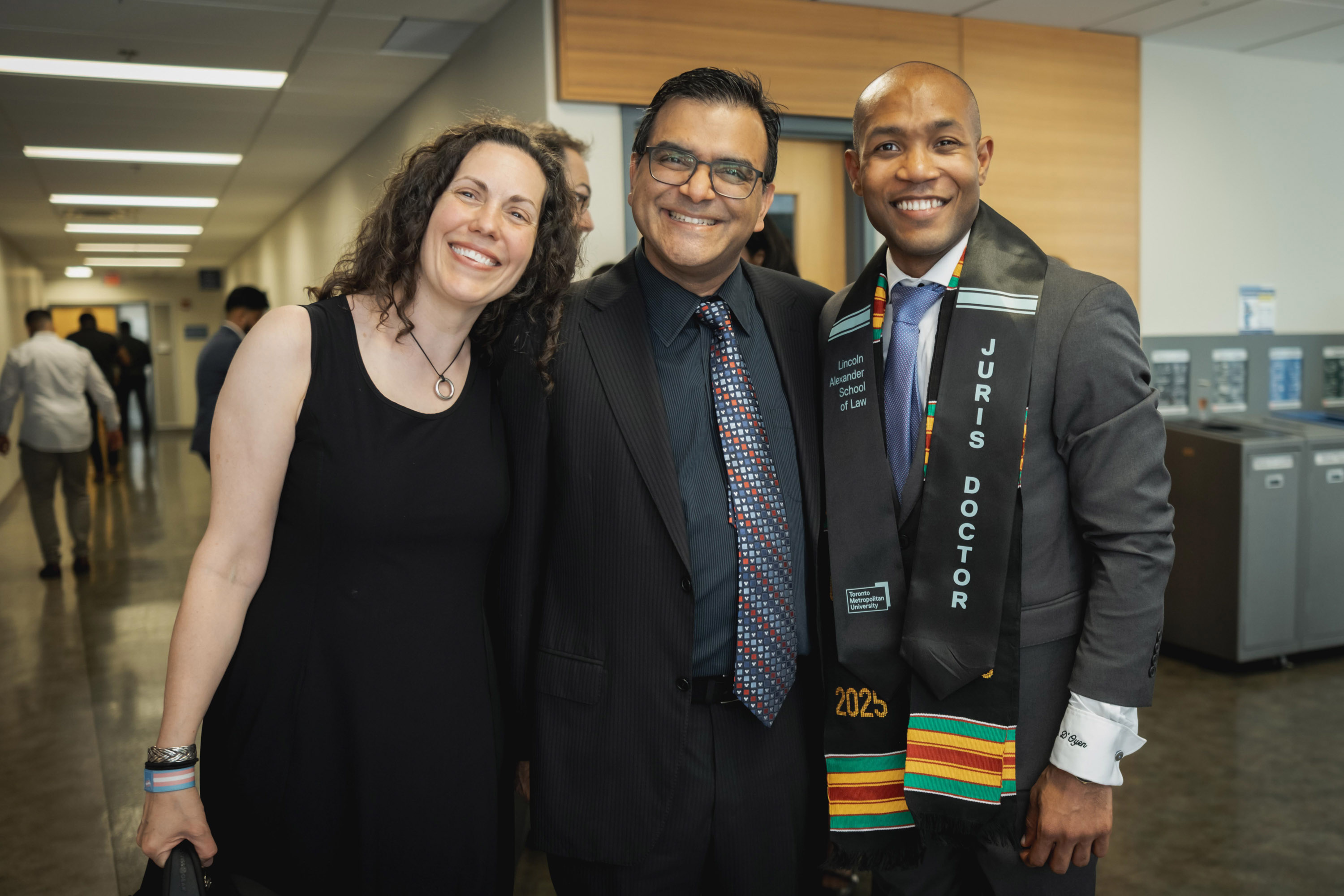 three faculty posing for photo