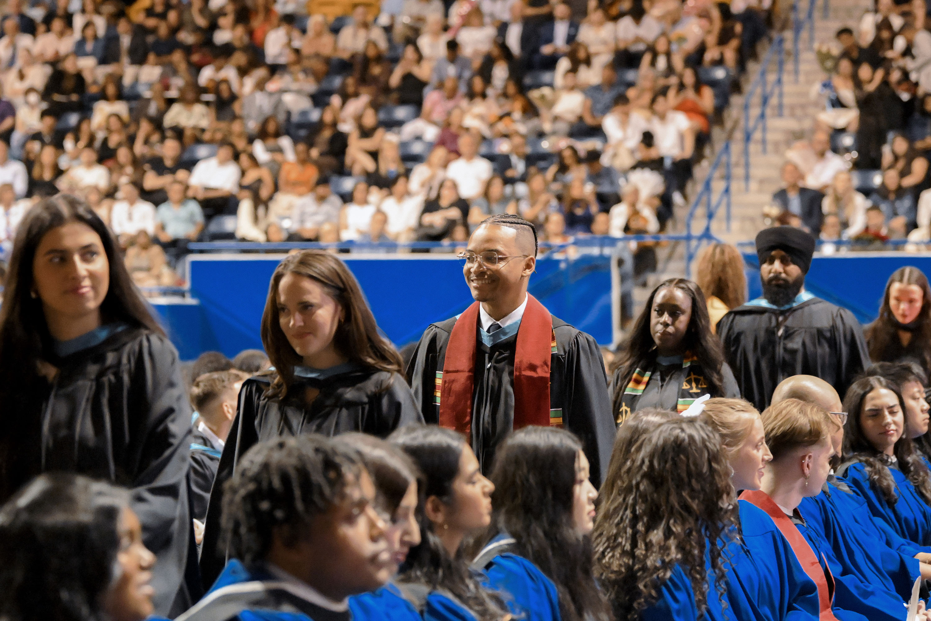 grads walking from seating