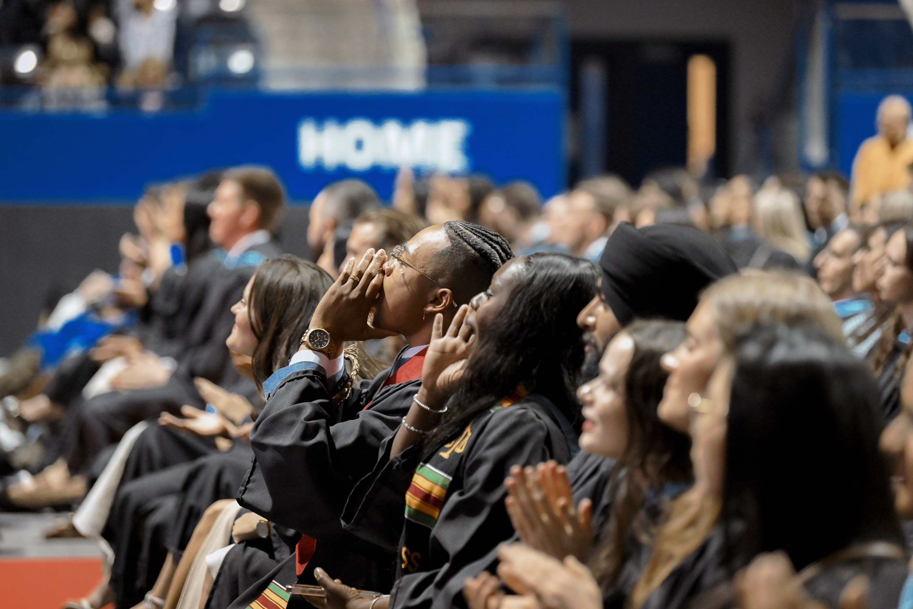grads cheering from audience