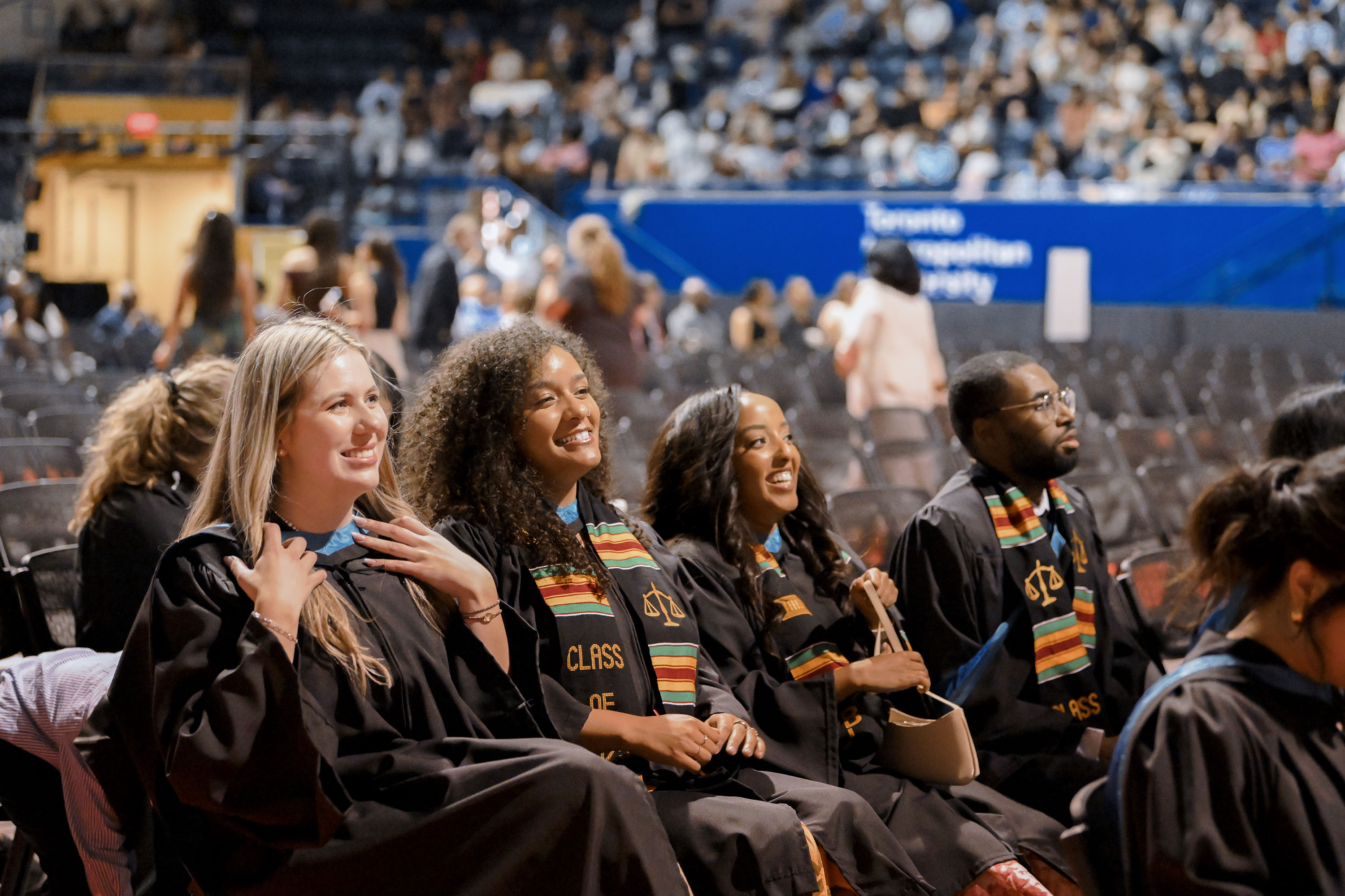grads looking on from seats