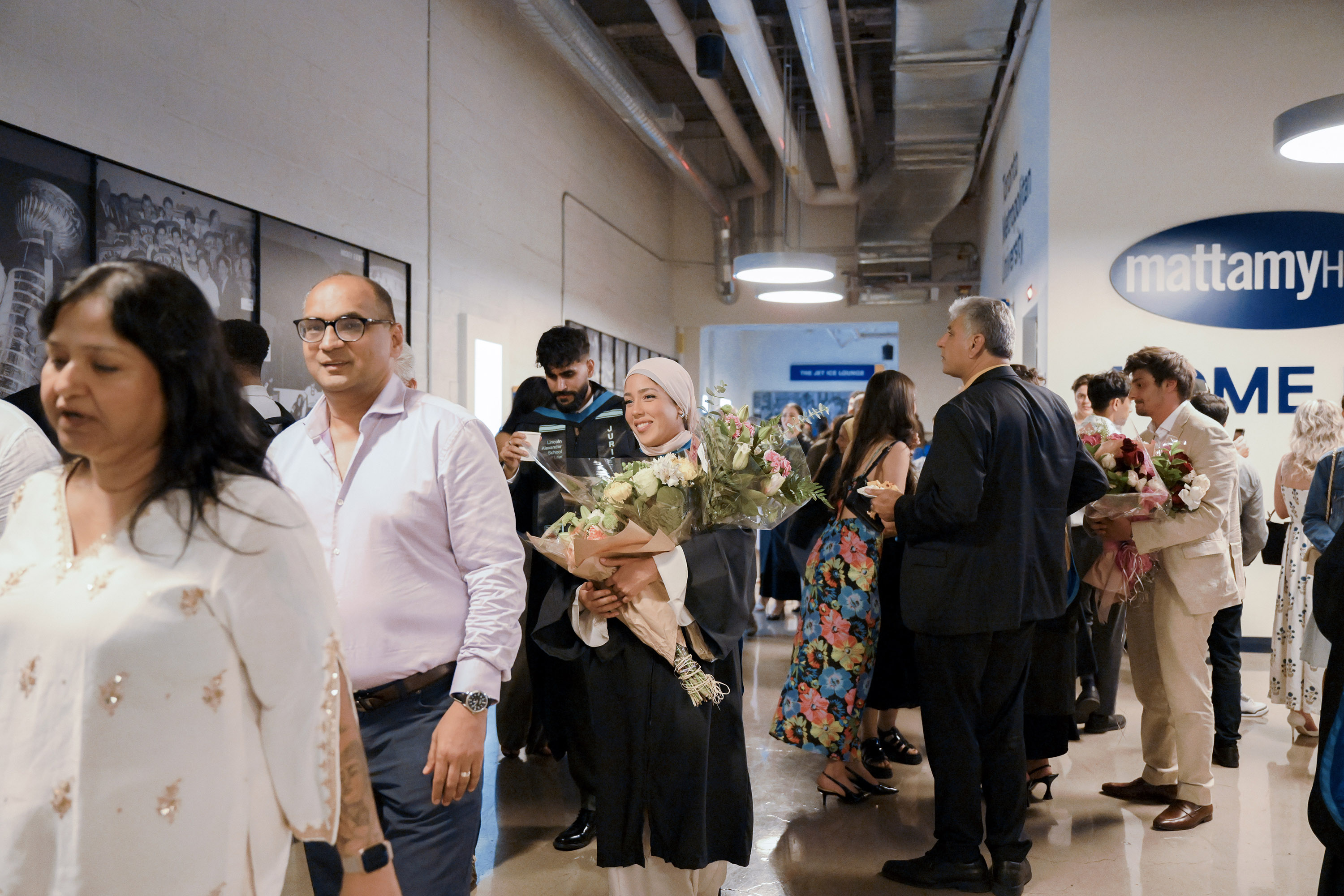family and grads in mattamy hallway