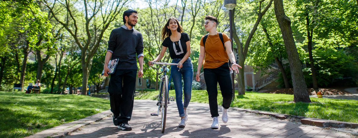 Three students walking on TMU campus