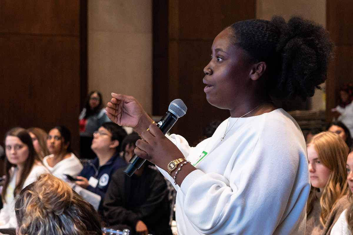 people gathered in conversation at fertility justice event