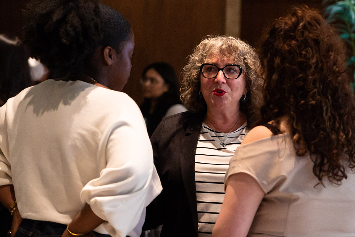people gathered in conversation at fertility justice event