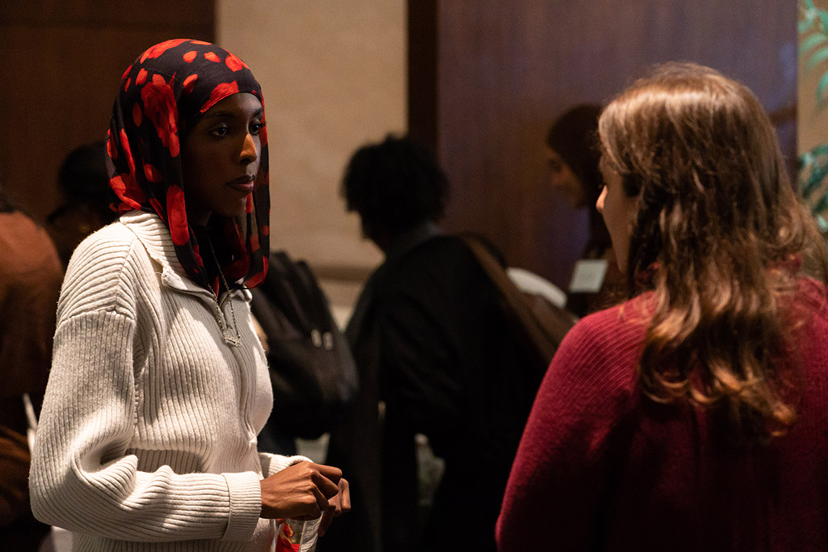 people gathered in conversation at fertility justice event