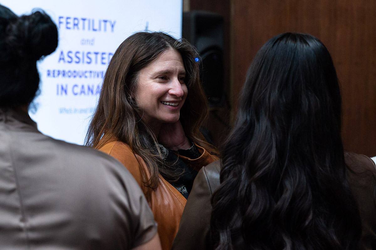 people gathered in conversation at fertility justice event