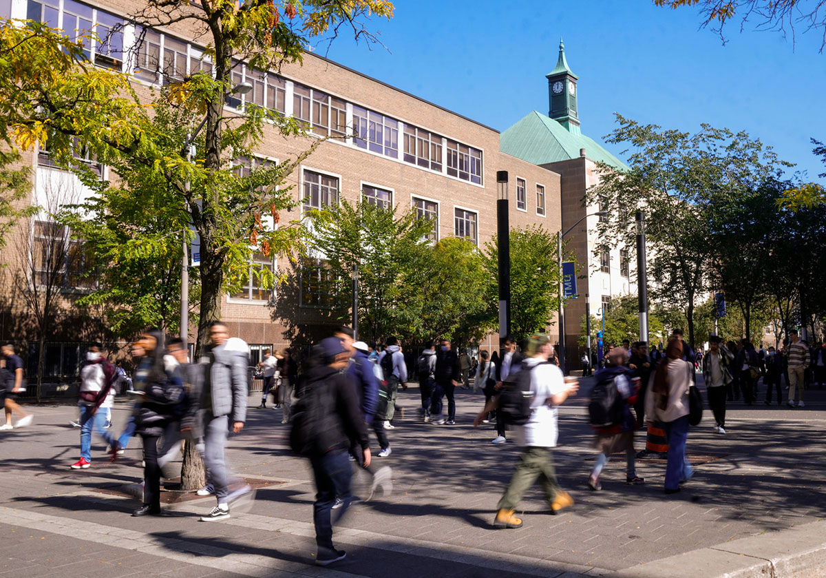 People walking across Gould Street infront of Kerr Hall.