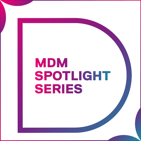 MDM Spotlight Series graphic featuring a large stylized letter “D” outlined in a pink-to-blue gradient, with the words “MDM Spotlight Series” centered inside. The design uses rounded geometric shapes in gradient colors on a white background.