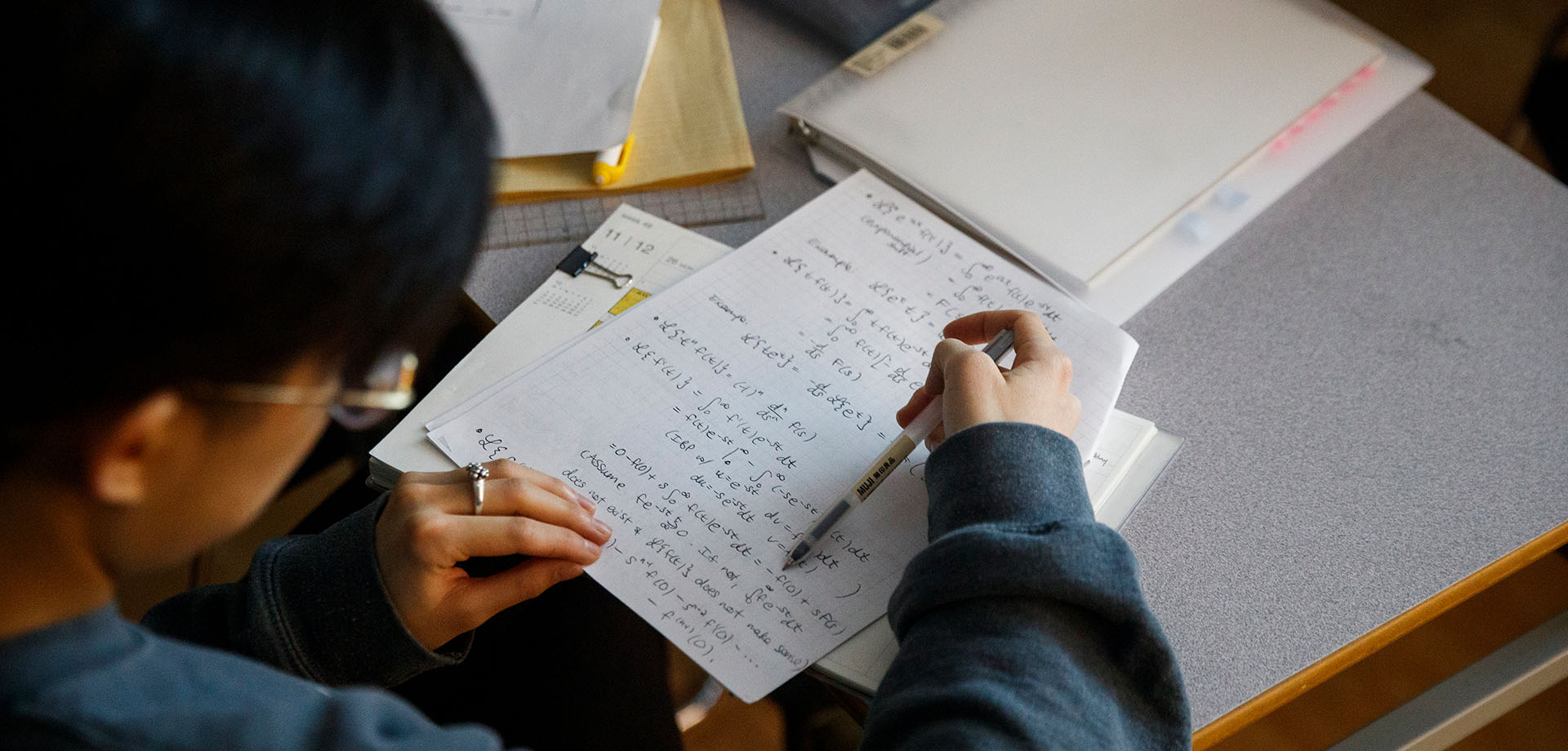 Math undergraduate student working on class assignment