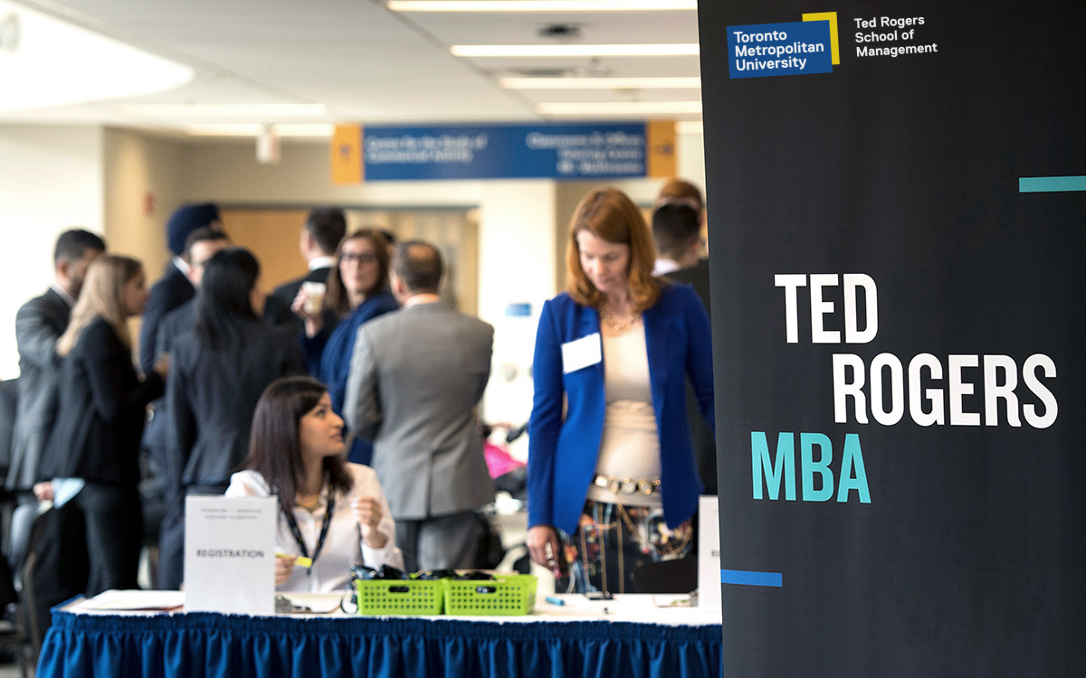 Ted Rogers MBA pull up banner in front of a reception table