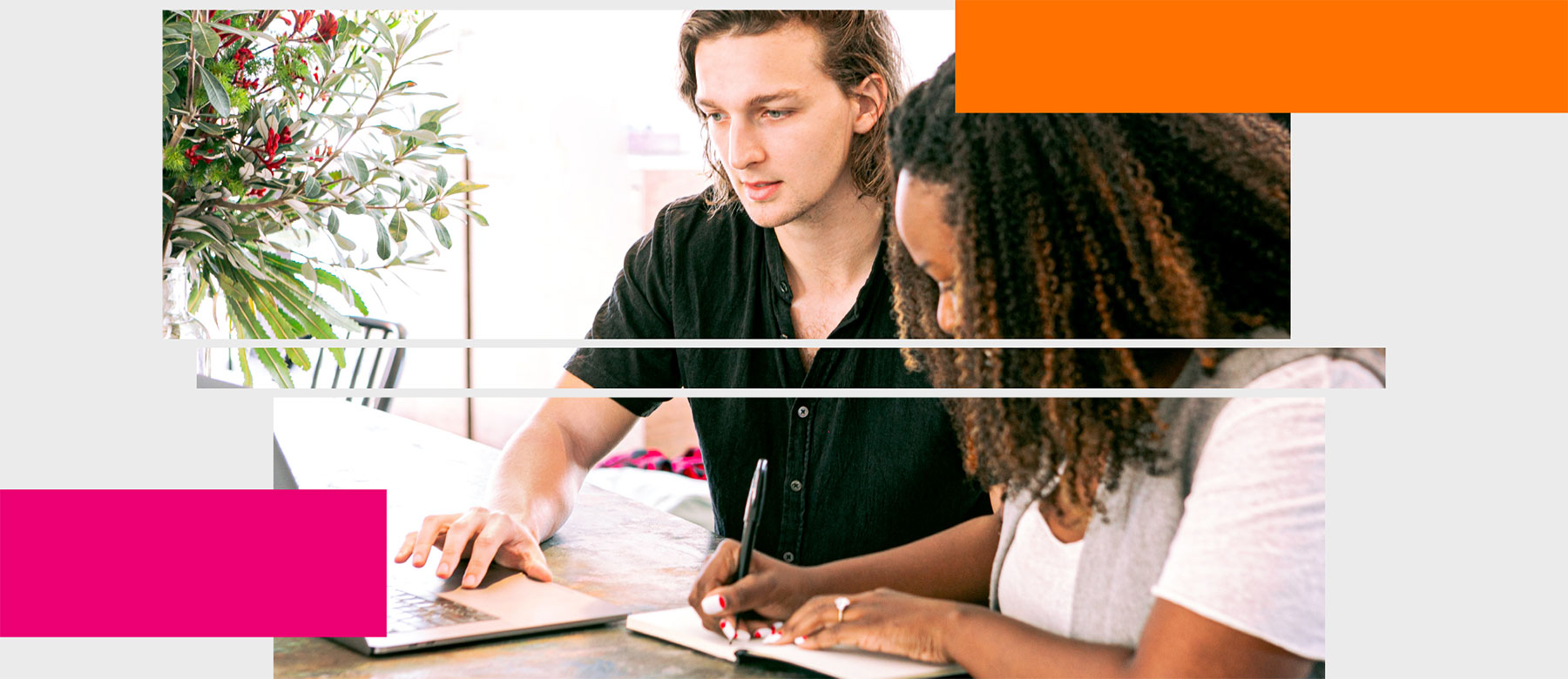 Two people collaborating on writing project on a laptop