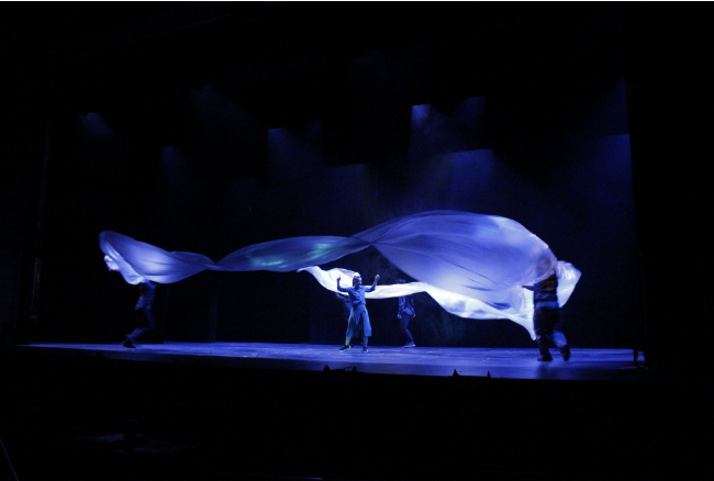 Performers on a stage.
