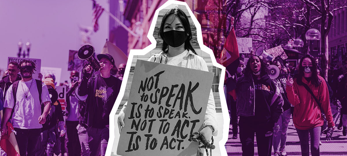 Female protester wearing a mask, holding a sign that reads Not to Speak is to Speak, Not to Act is to Act,