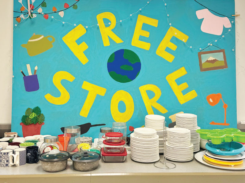 Hand-made Free Store poster in the Free Store surrounded by kitchen items.
