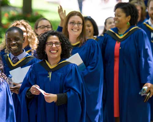 Students graduating at convocation in their gowns.