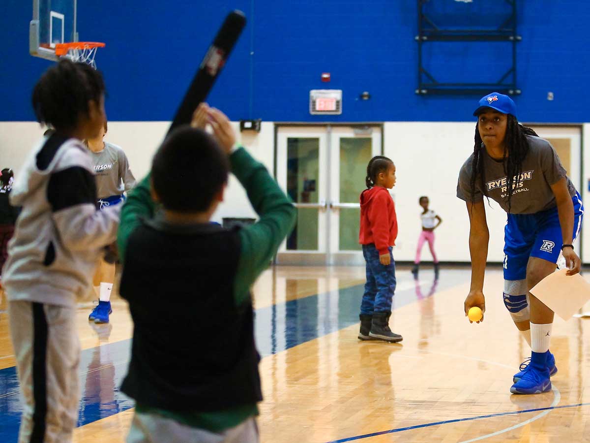 Tashana McDonald pitching to children