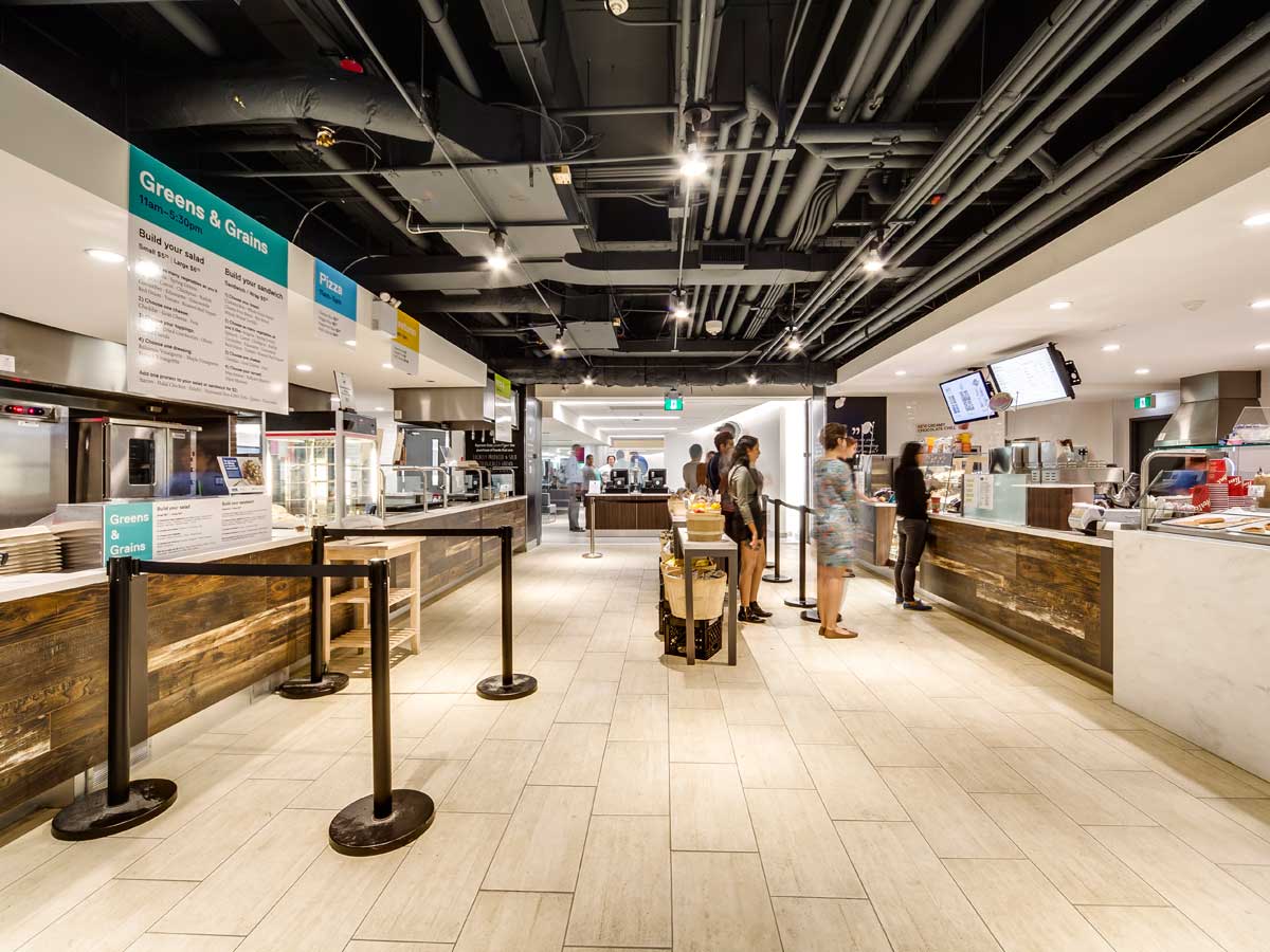 People lining up for food in the Hub