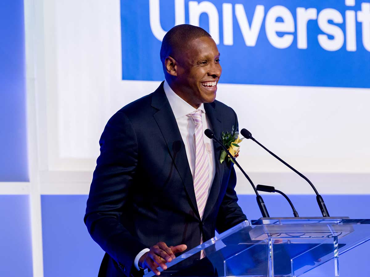 Masai Ujiri talking at podium on stage
