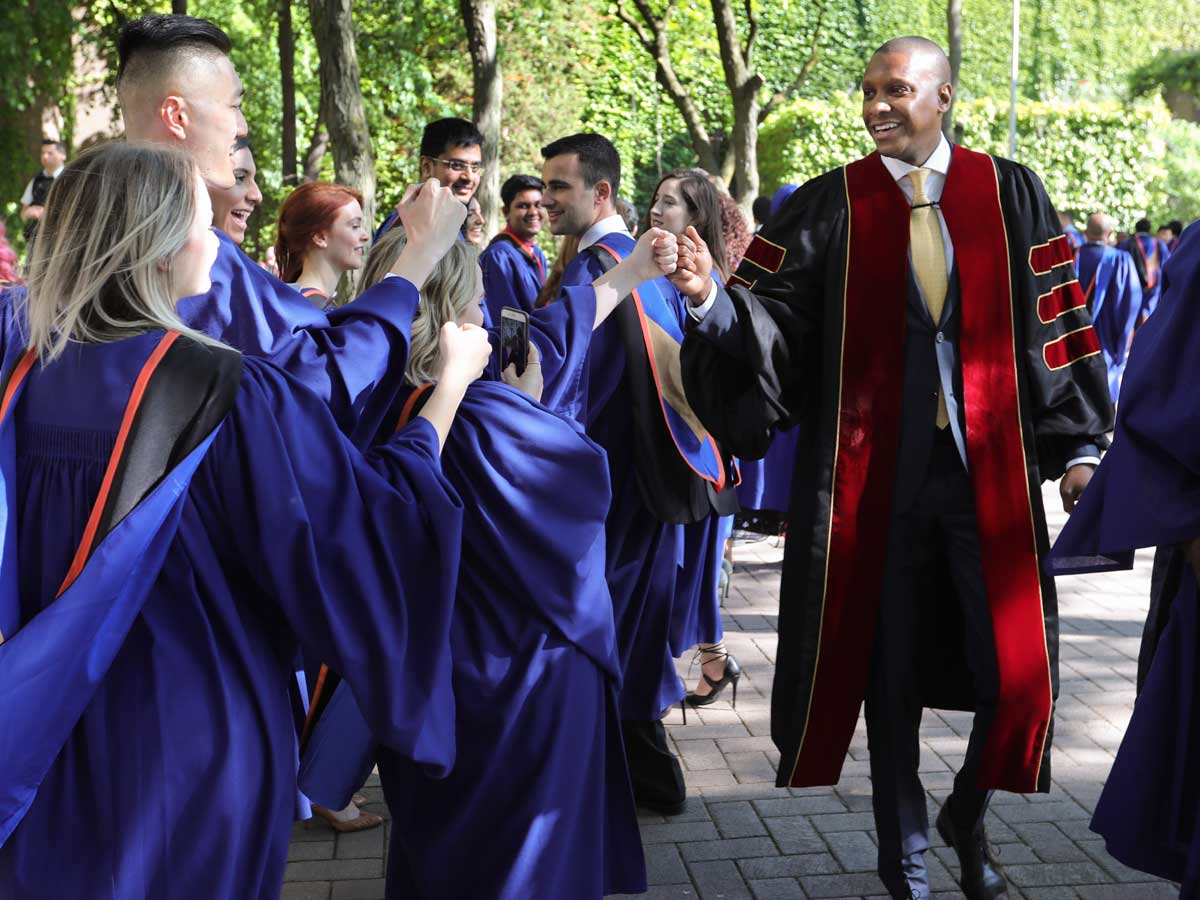 Masai Ujiri congratulating grads