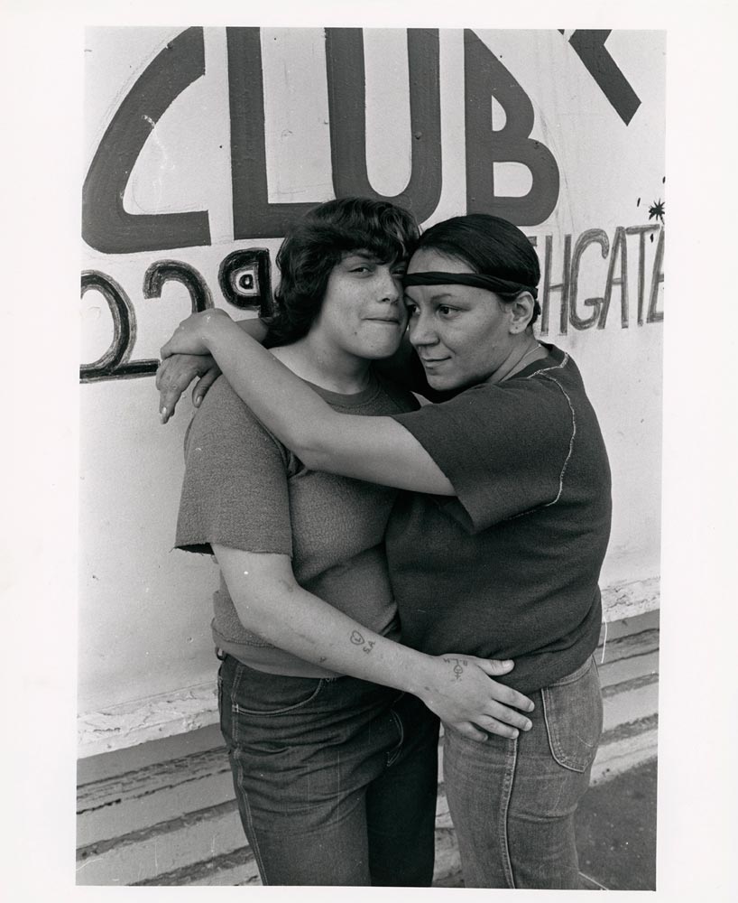 Black and white photo of two women embracing