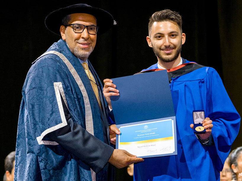 President Lachemi, left, presents Seyed Shahriar Riazi with the Ryerson gold medal at convocation