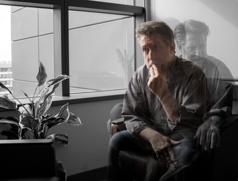 Man sitting in a chair pensively