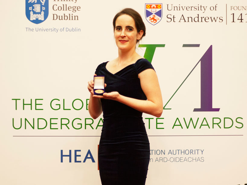 Emily Morrison holding her medal at the Global Undergraduate Summit in Ireland
