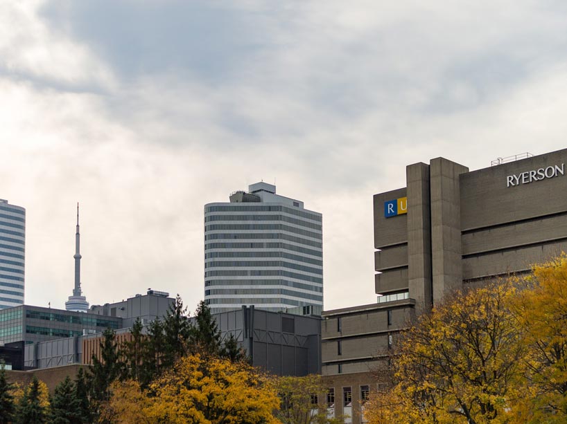 Aerial shot of Ryerson University's Library building with the CN Tower in the background