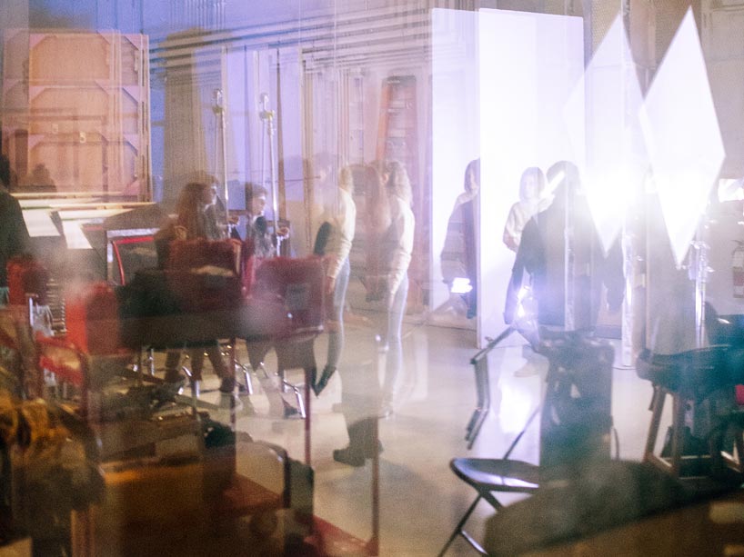 A blurry shot of students setting up a film scene