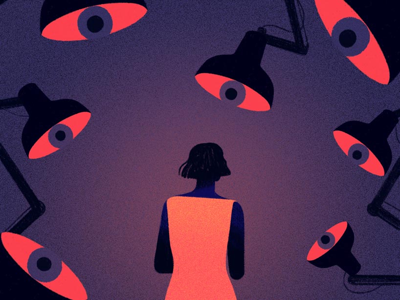 Woman under the spotlight of interrogation lamps