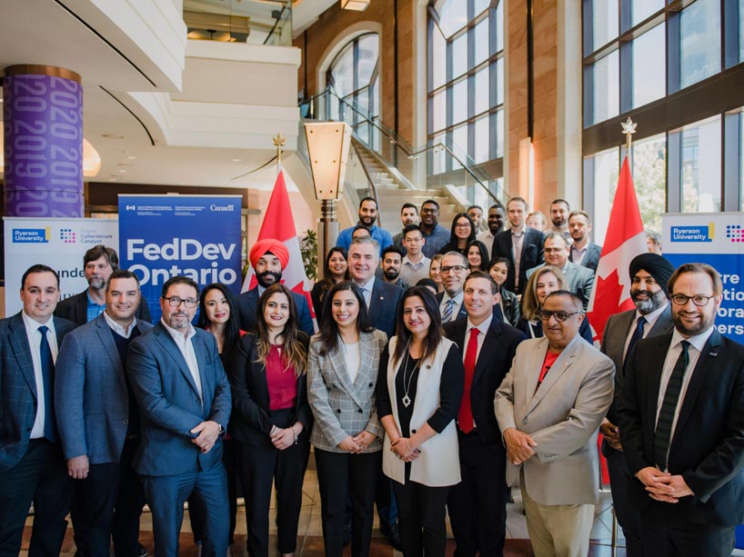 Officials from Ryerson University, Rogers Communications, FedDev, the federal government, City of Brampton and RBC at the announcement of $30-million investment for the Rogers Cybersecure Catalyst. 