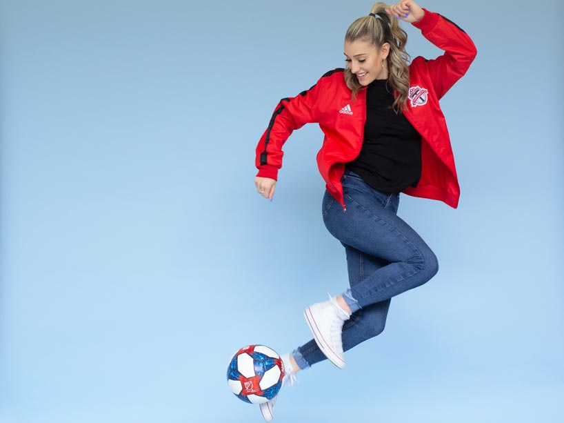 Maria Papadakis kicks a soccer ball