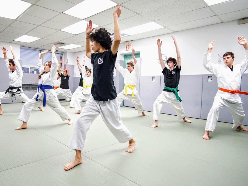 Youth try out a new martial arts move 