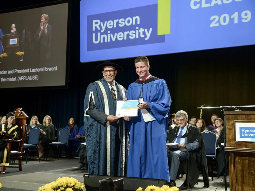 From left: Mohamed Lachemi and Declan Keogh, holding his award on stage