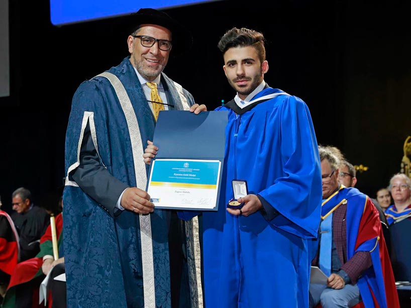From left: Mohamed Lachemi and Zagros Habibi, holding his award on stage