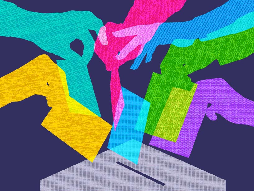 An illustration of different coloured hands dropping their voting cards into a ballot box