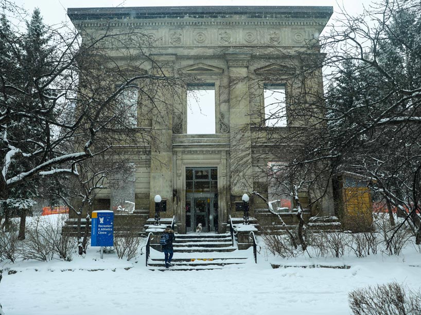 Student walking up steps into Ryerson Athletic Centre