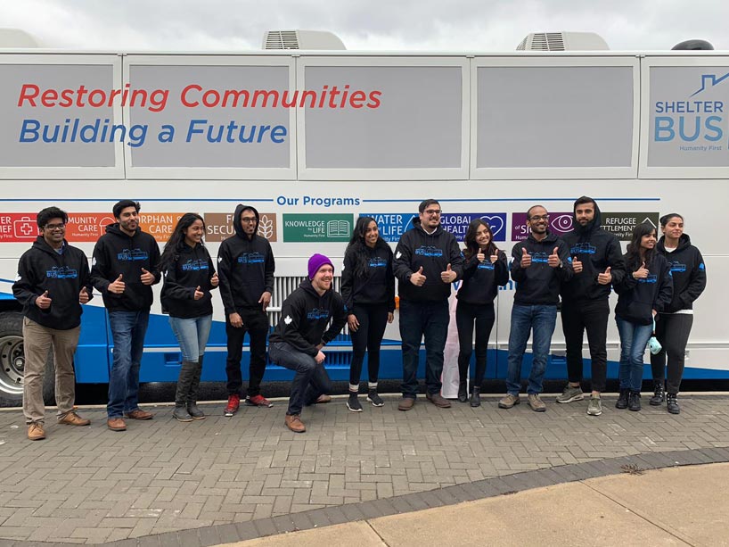 Team of volunteers standing with the Shelterbus 