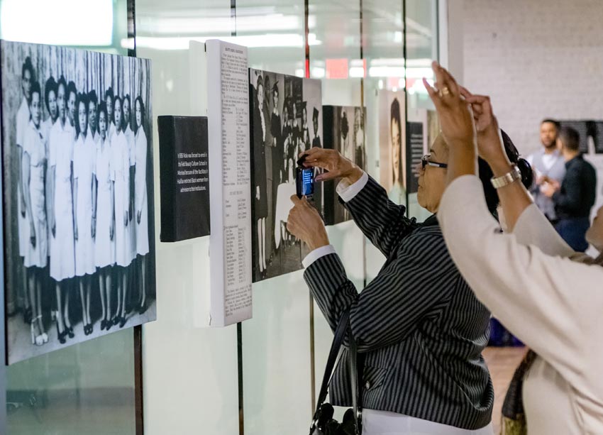 People taking a photo of artwork