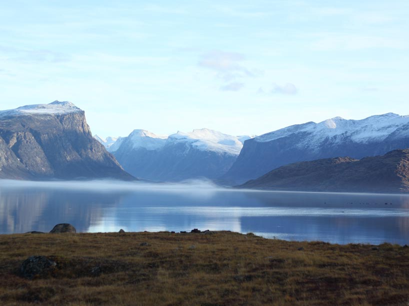 calm lake and mountains in placid Arctic landscape