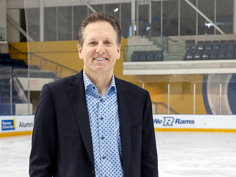 Mitch Frazer standing inside an ice rink