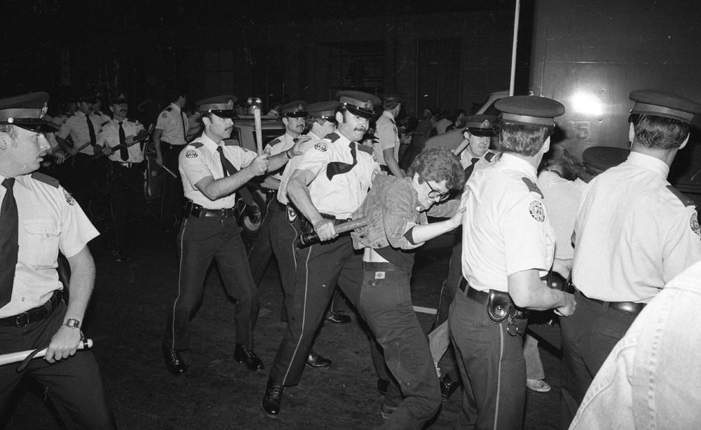 Police and protestors engage in an altercation at a protest.