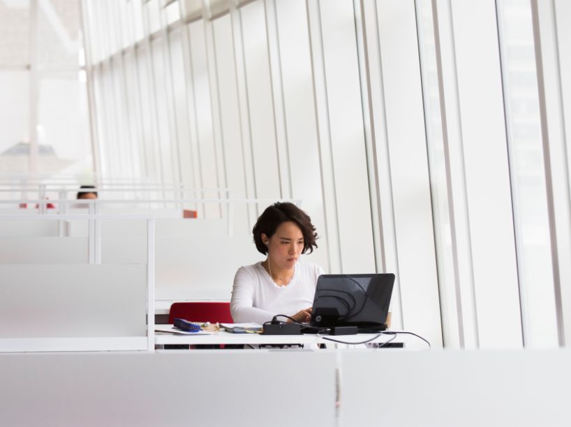 A woman working on a laptop