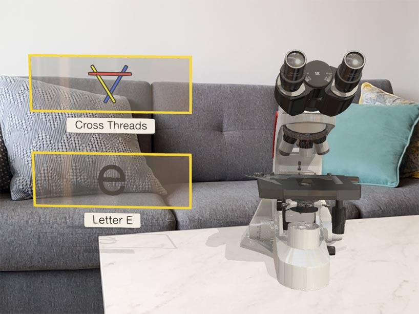 A hologram microscope sits on the coffee table of a user’s home