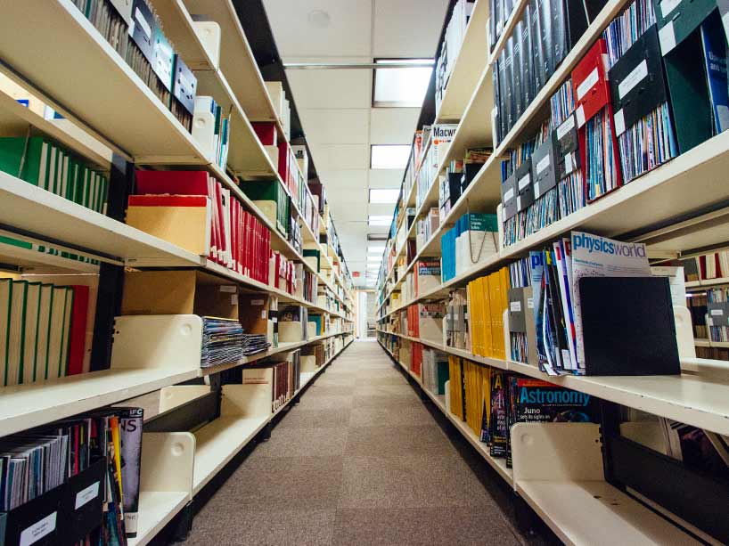 An aisle of books in the Ryerson Library.